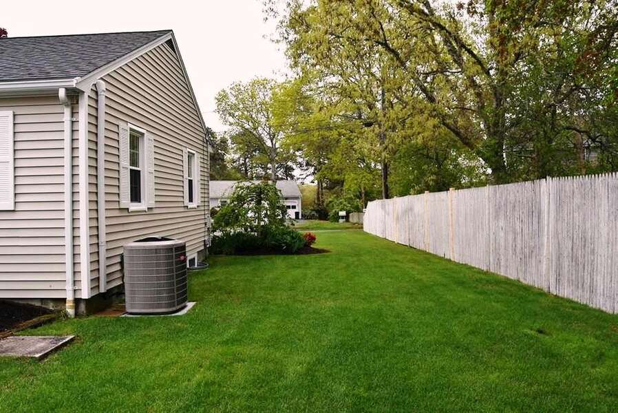 Well manicured lawn - Privacy fence around entire back yard - open to front- 22 Muscovy Lane West Yarmouth Cape Cod - New England Vacation Rentals