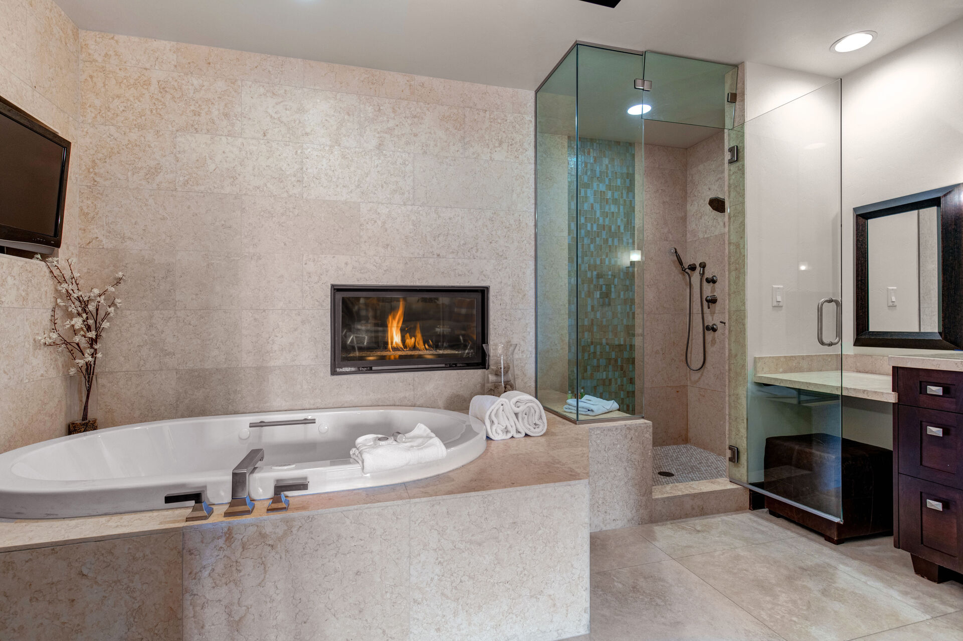 Grand Master Bath with Separate Vanities, Jetted Tub, Gas Fireplace, and a Separate Tile Shower