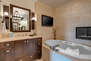 Grand Master Bath with Separate Vanities, Radiant Heated Floor and TV