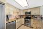 Breakfast Bar and Magnificent Kitchen with Stainless Steel Appliances and Granite Counter Tops