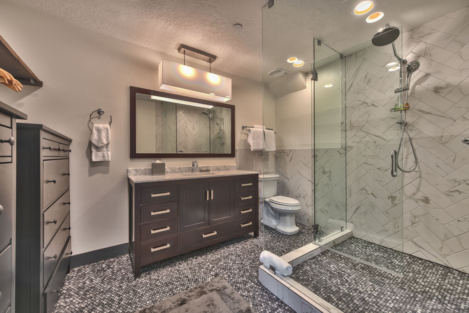 Private Bath with Stone/Tile Shower with Multiple Shower Heads