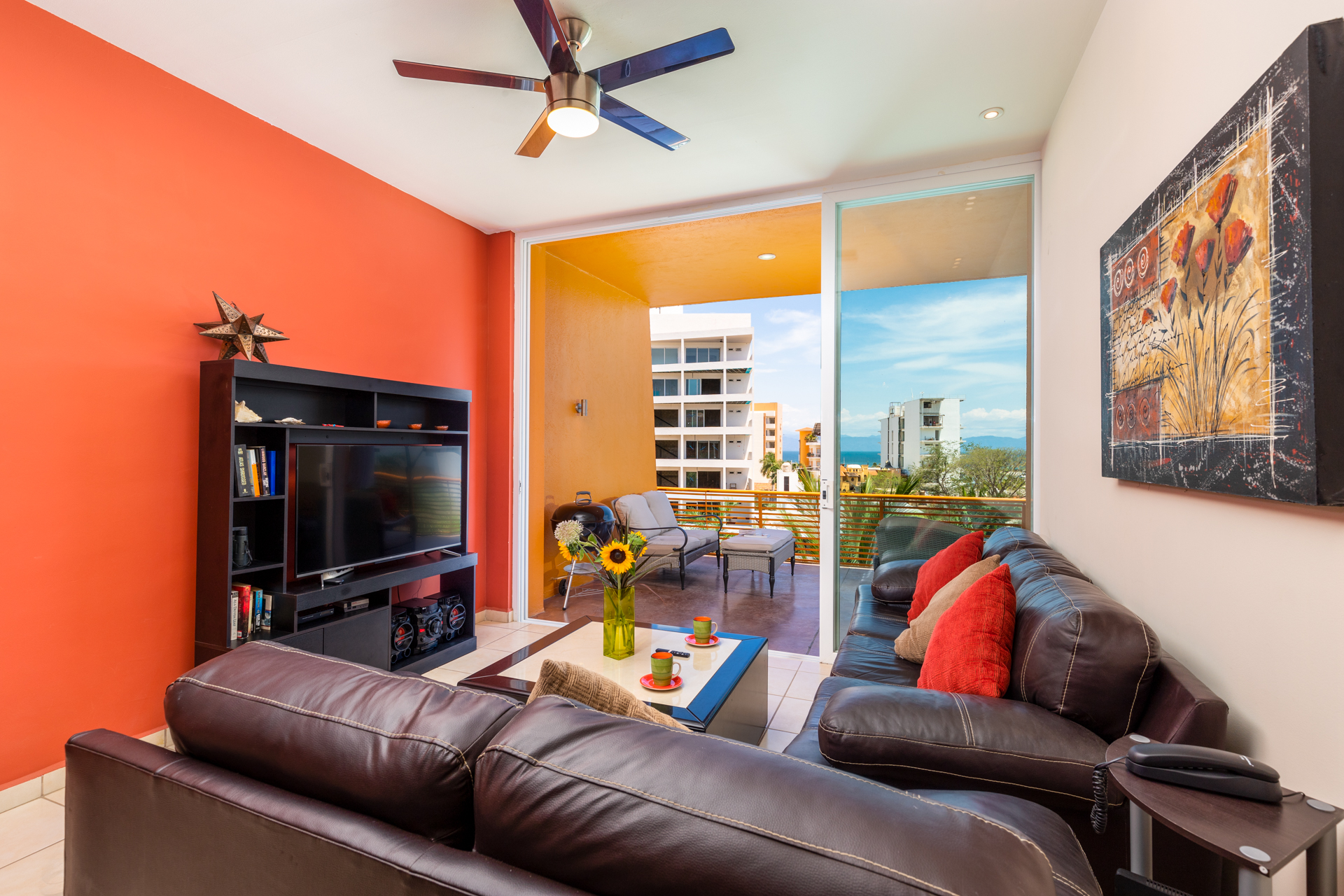 Fully equipped living room with T:V ceiling fan A/C and WiFi access.