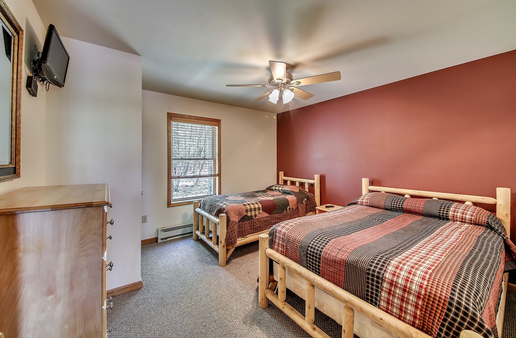 One of the Bedrooms with 2 Beds and a Flat Screen TV in our Coyote Vacation Rental