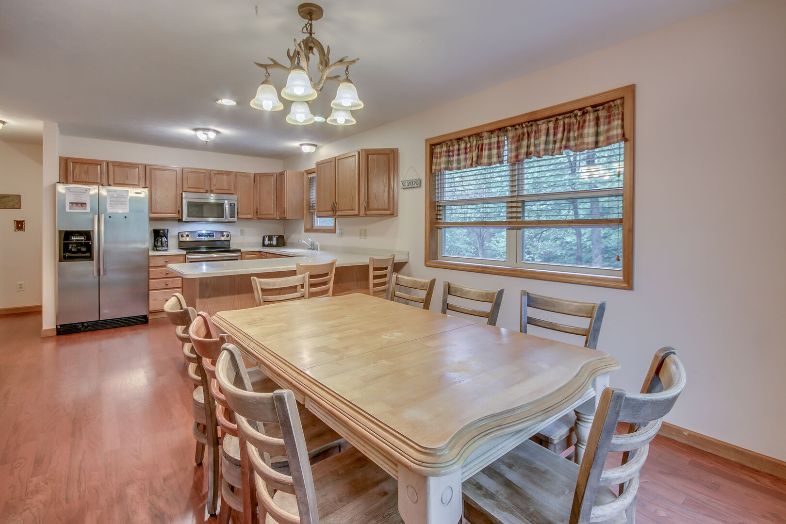 A Kitchen Table with Seven Chairs in Our Vacation Rental in the Poconos by Lake.