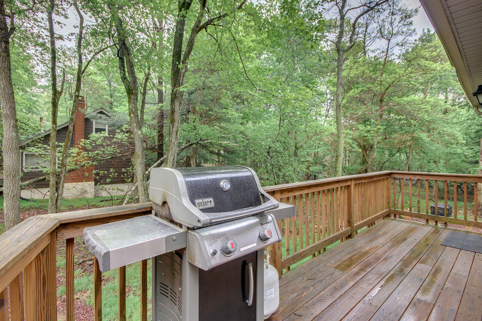 A Grill Located on the Deck Attached to Our Vacation Rental in the Poconos by Lake.