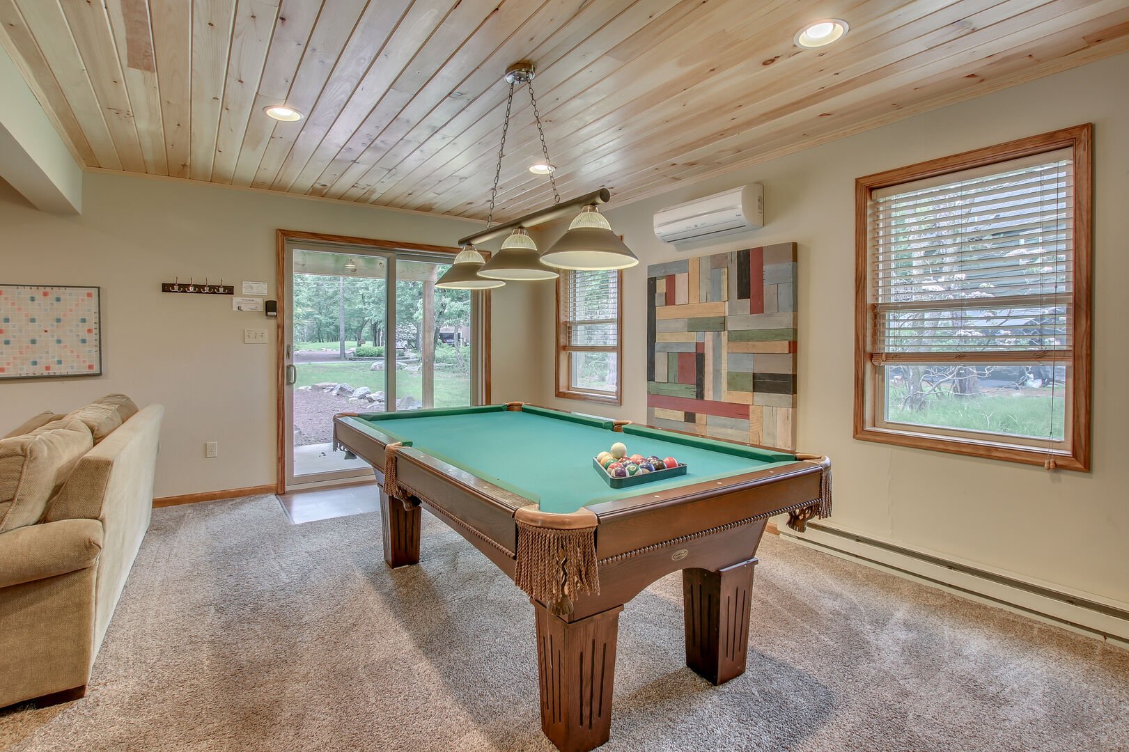 basement with pool table and nearby sliding door