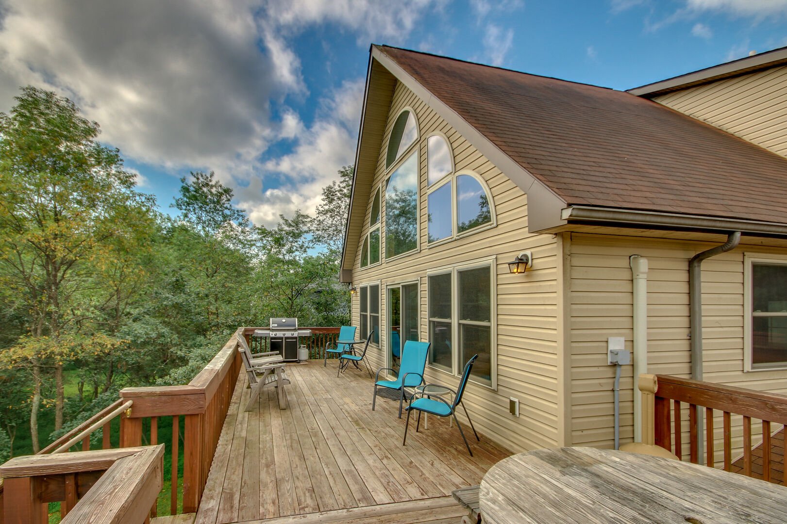 Upstairs Deck, Patio Chairs, and Grill of our Towamensing Trails Vacation Rental.