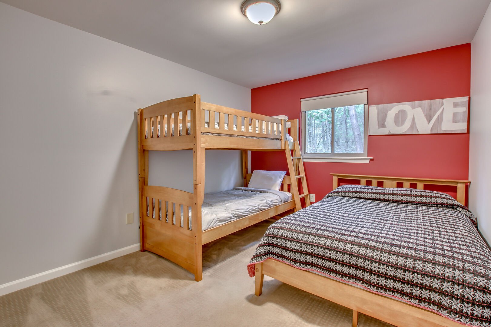 Bedroom with a Bunk-Bed, and a Large Bed on our Lake Harmony Home for Rent.