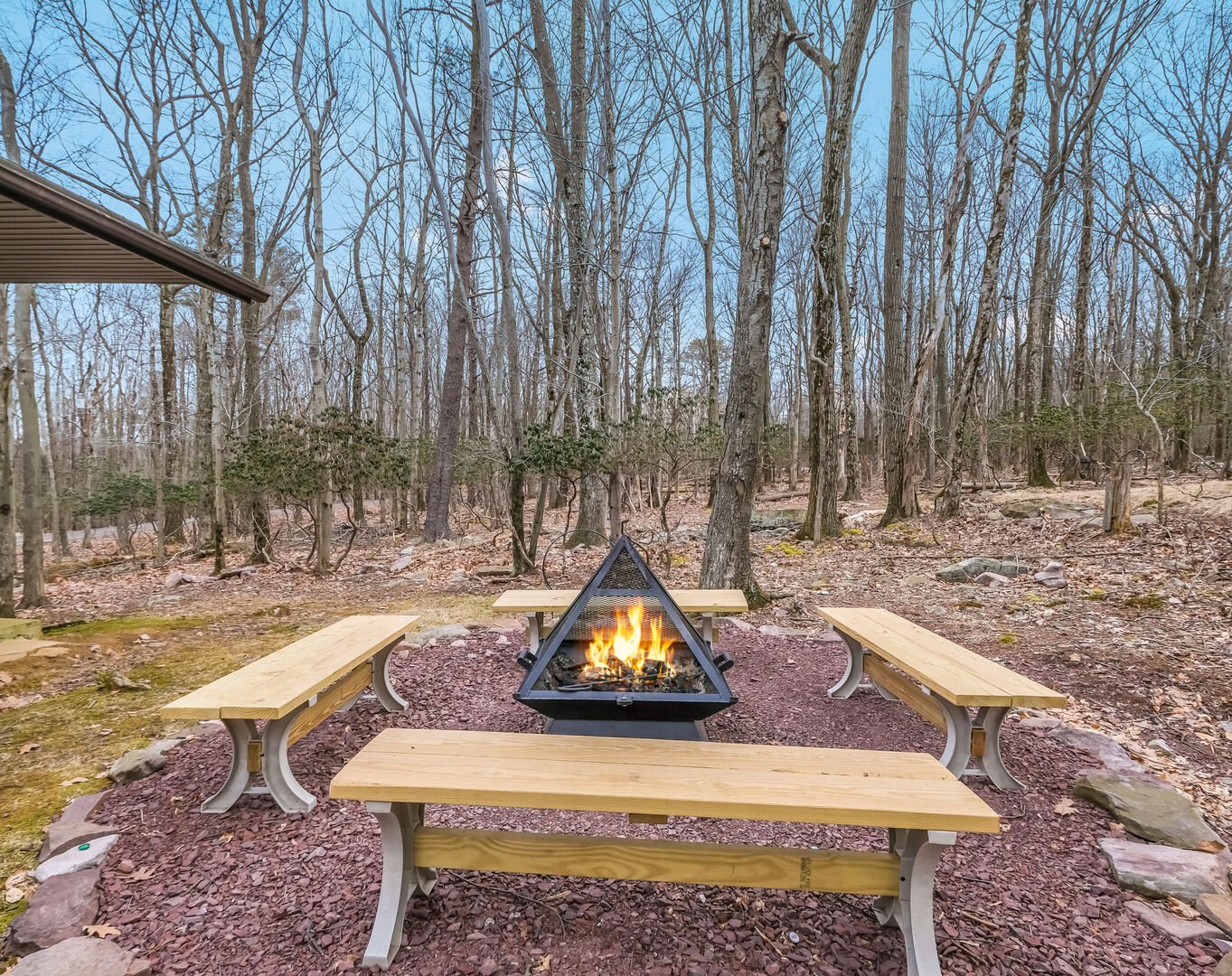 Outdoor Seating Area with Benches and Fire Pit.
