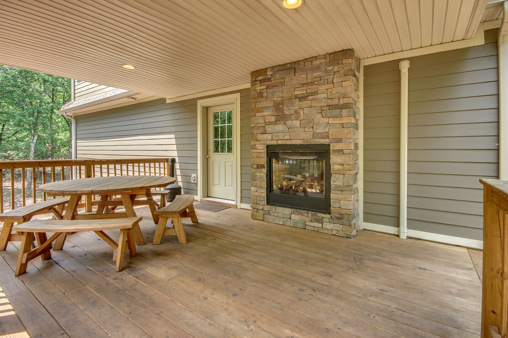 Covered Deck with Seating and Outdoor Fireplace