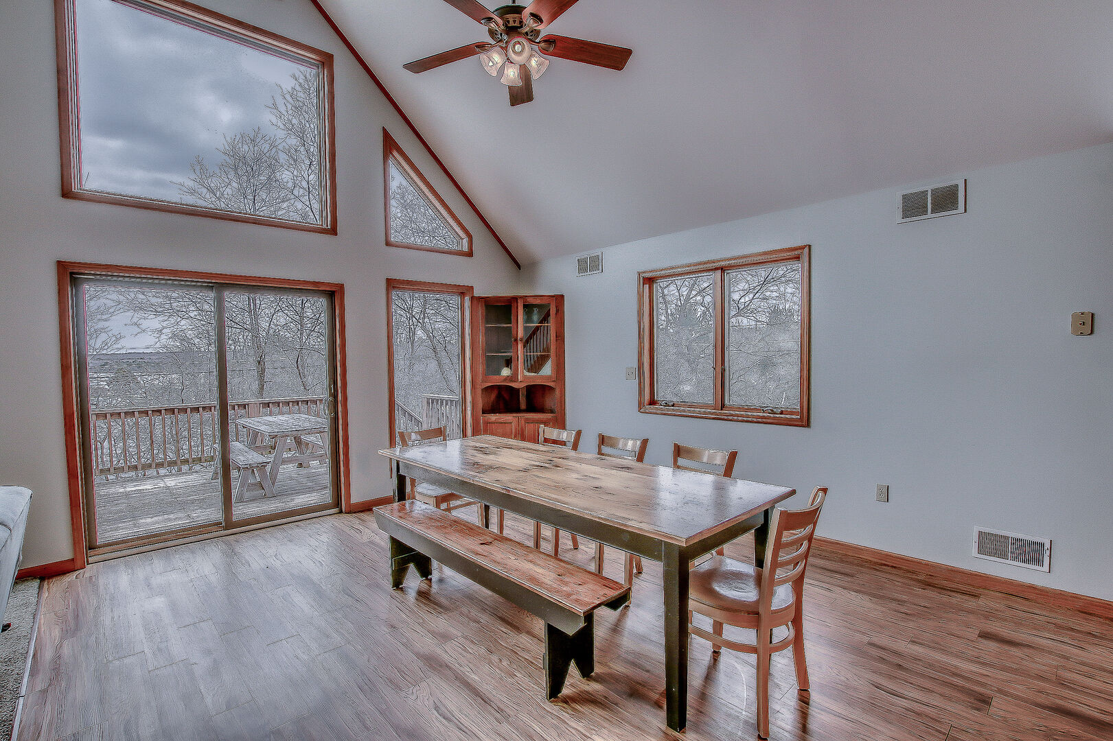 Dining Room Featuring Large Windows and Kitchen Table.