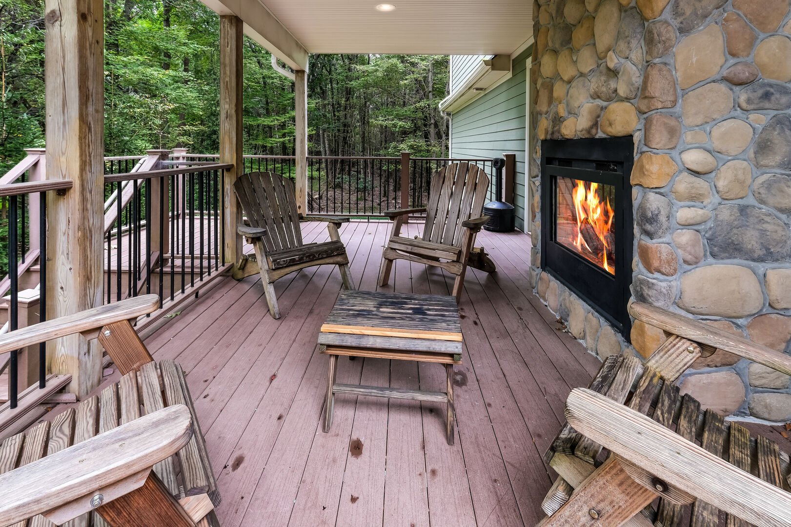 Outside porch and fireplace of our Pocono Getaway Rental