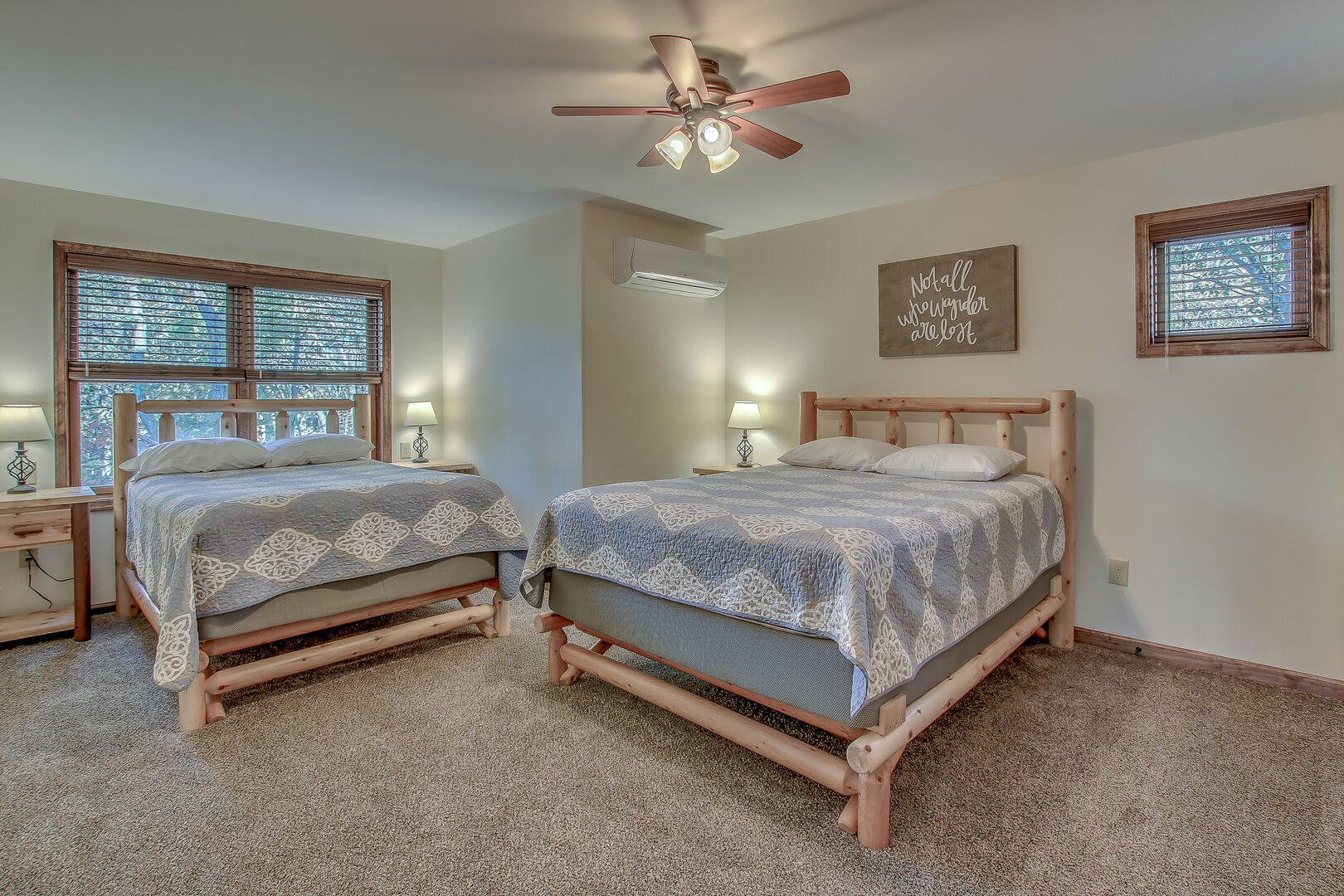Spacious Bedroom with Two Beds and Ceiling Fan