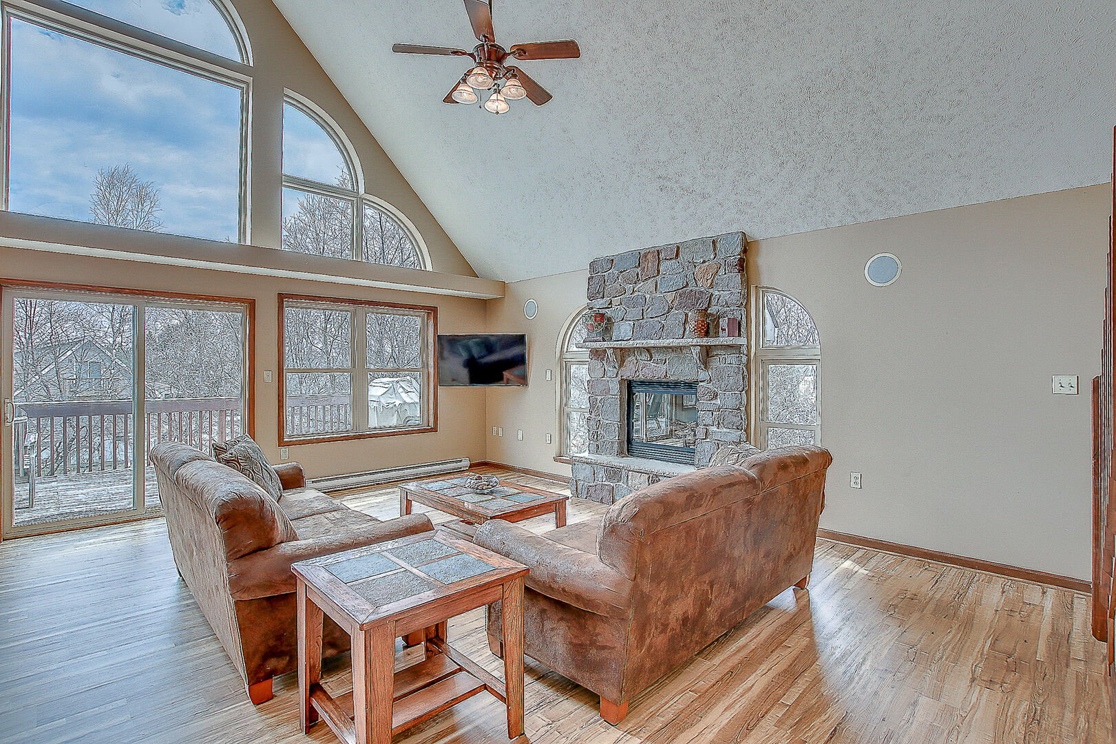 Great Room with Stone Fireplace and Comfy Seating for TV Viewing and Catching up.