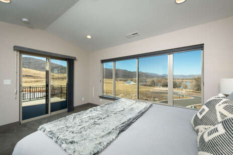King Master Bedroom with Ensuite Bathroom & Walk Out to Upper Deck