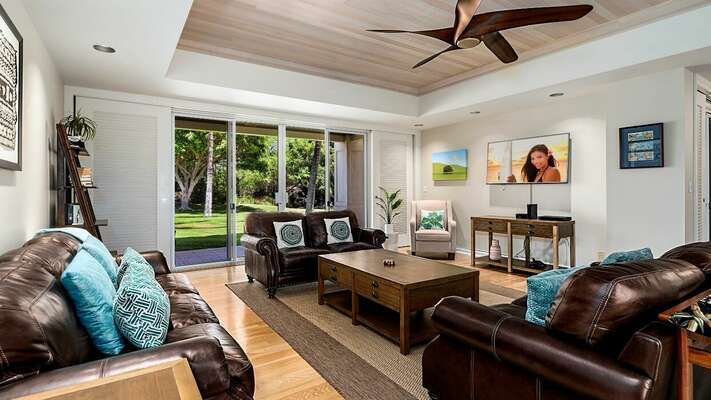 Living Area with Comfortable Sofas, Ceiling Fan, and Smart TV