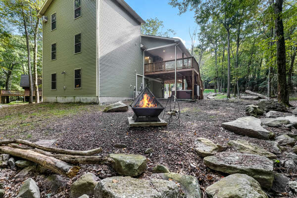 Outdoor fire pit of this luxurious Poconos vacation rental.