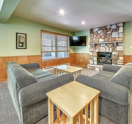 Couches, Fireplace, and Flat Screen TV in our Poconos Lodge Rental