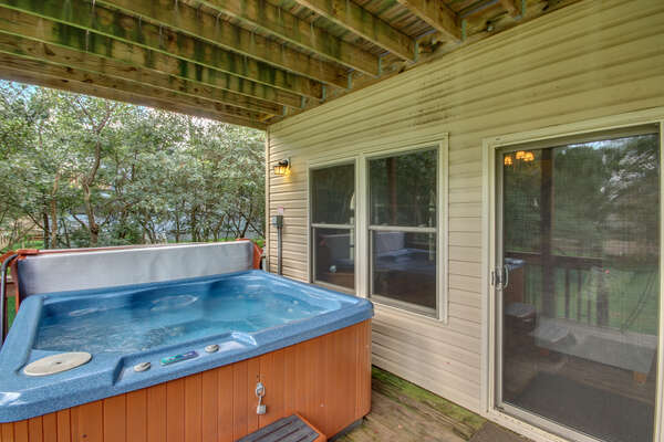Hot Tub with Water Running on the Deck of our Towamensing Trails Vacation Rental.