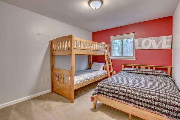Bedroom with a Bunk-Bed, and a Large Bed on our Lake Harmony Home for Rent.
