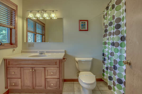 Large Sink, Toilet, and Bathtub in Bathroom.