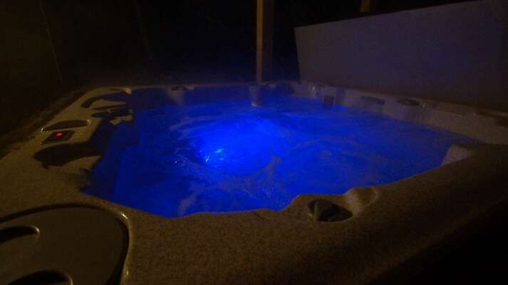 Hot Tub lit up at night
