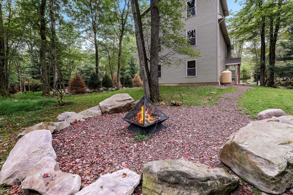 Fire Pit in Yard with Side View of Home