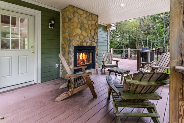 Outdoor fireplace and chairs in our Pocono Getaway Rental