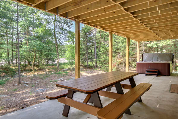 Picnic Table and Hot Tub Outside our Poconos Vacation Rental Home