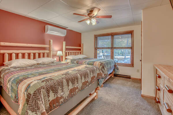 Bedroom with Two Beds, Ceiling Fan and Dresser