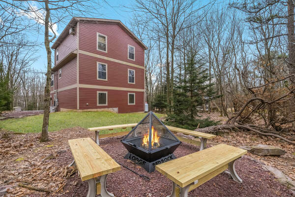 Toasty Warm by the Fire Pit with Four Wooden Benches.