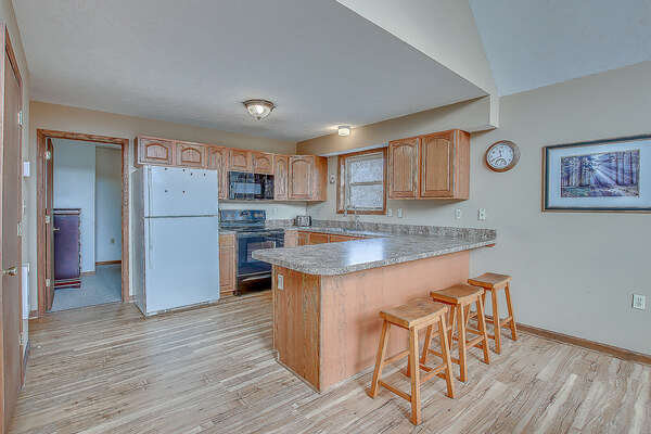 Kitchen with Counter, Refrigerator, and Dishwasher in our Towamensing Trails Vacation Rental.