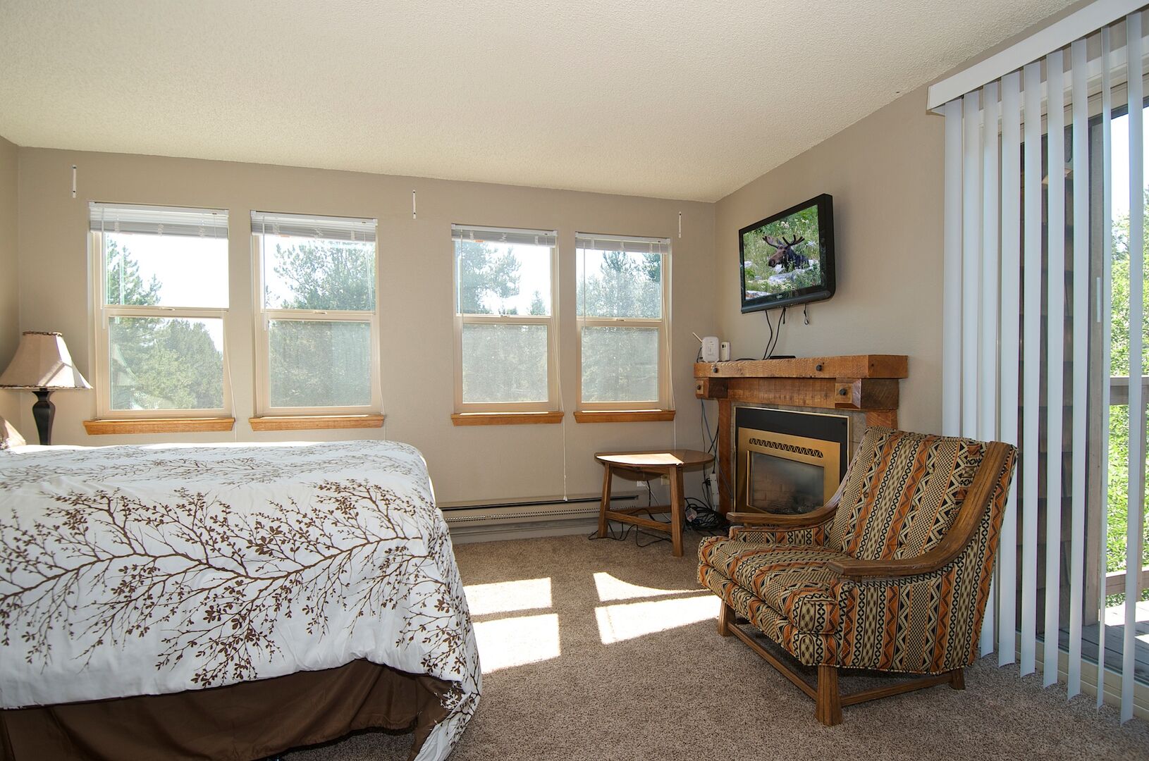 Quickdraw ~ bedroom #3 on upper level w/ queen bed, private entrance to shared bathroom, and private balcony