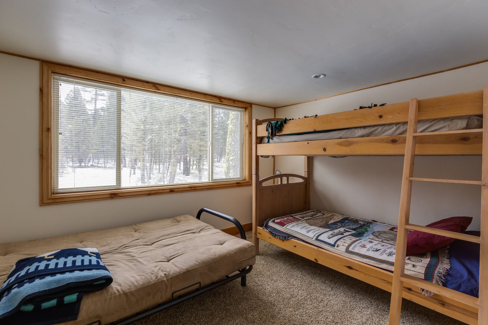Roger Dodger - accommodations above garage (NOT available in winter. See description for availability). Bedroom w/ a single over single bunk bed and a twin futon. Bedroom # 4.