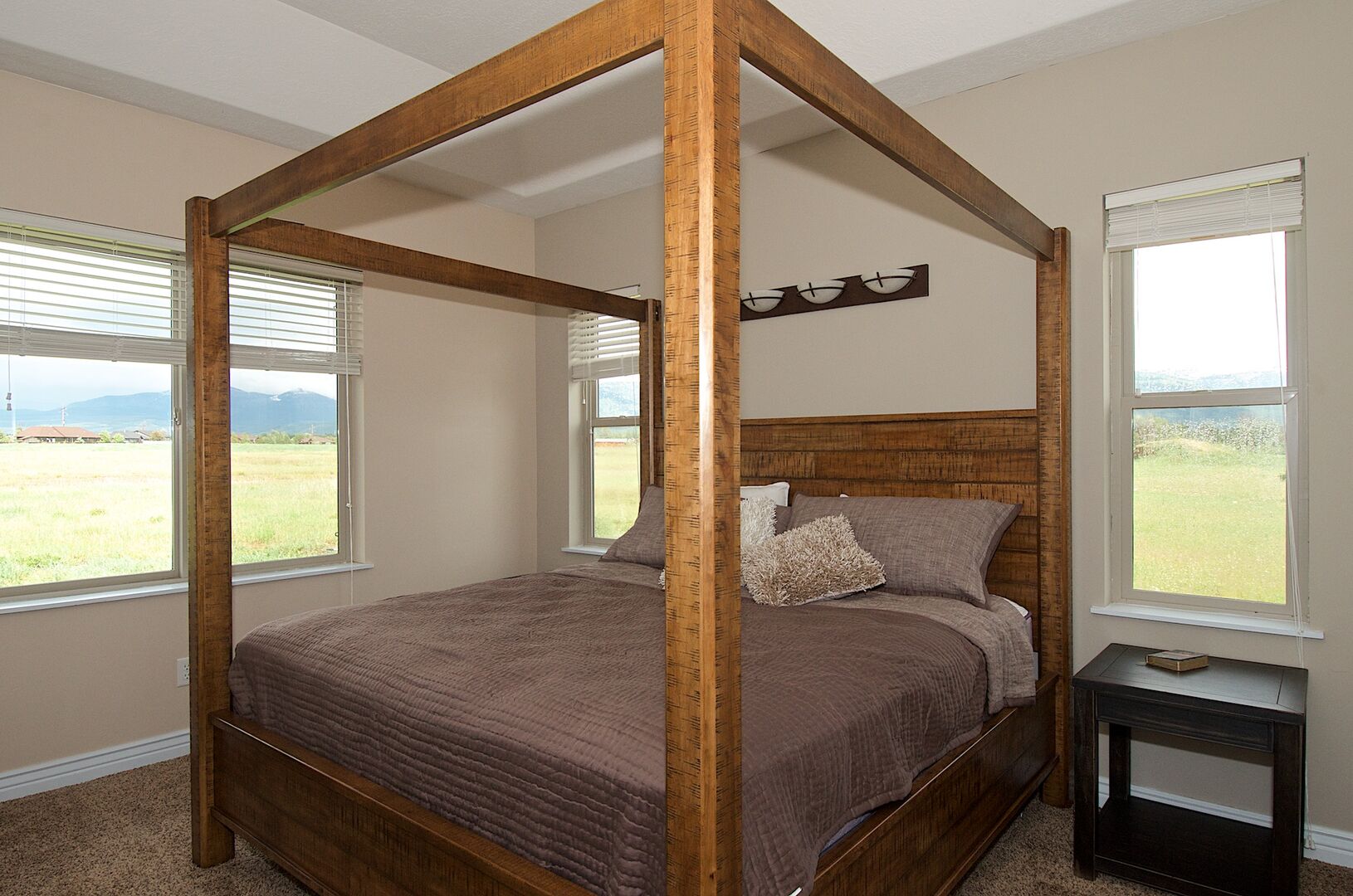Teton Harmony ~ bedroom #1 on main level w/ king bed and private ensuite bathroom