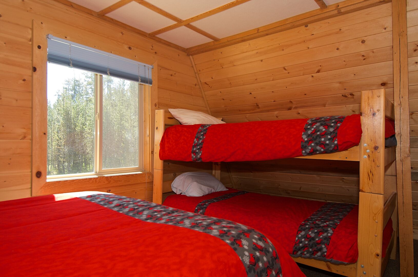 Grey Wolf Retreat ~ bedroom on upper level w/ queen bed and twin over twin bunk bed