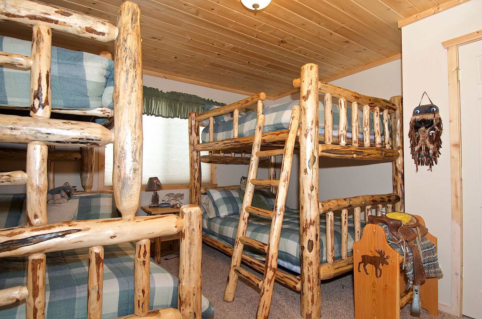 Wagon Wheel ~ bedroom #1 w/ a double over double bunk and a single over double bunk and private ensuite bathroom