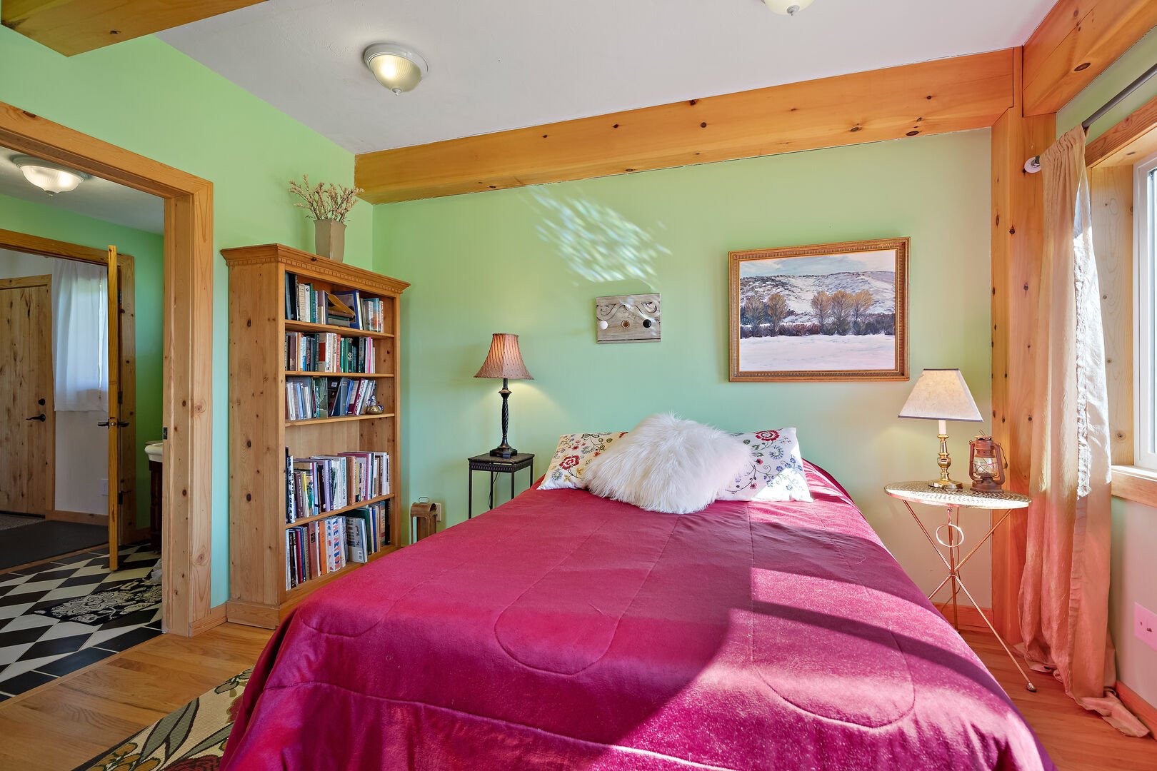 Henrys Lake Goose Bay ~ bedroom #1 on main level w/ queen bed and private access to shared bathroom