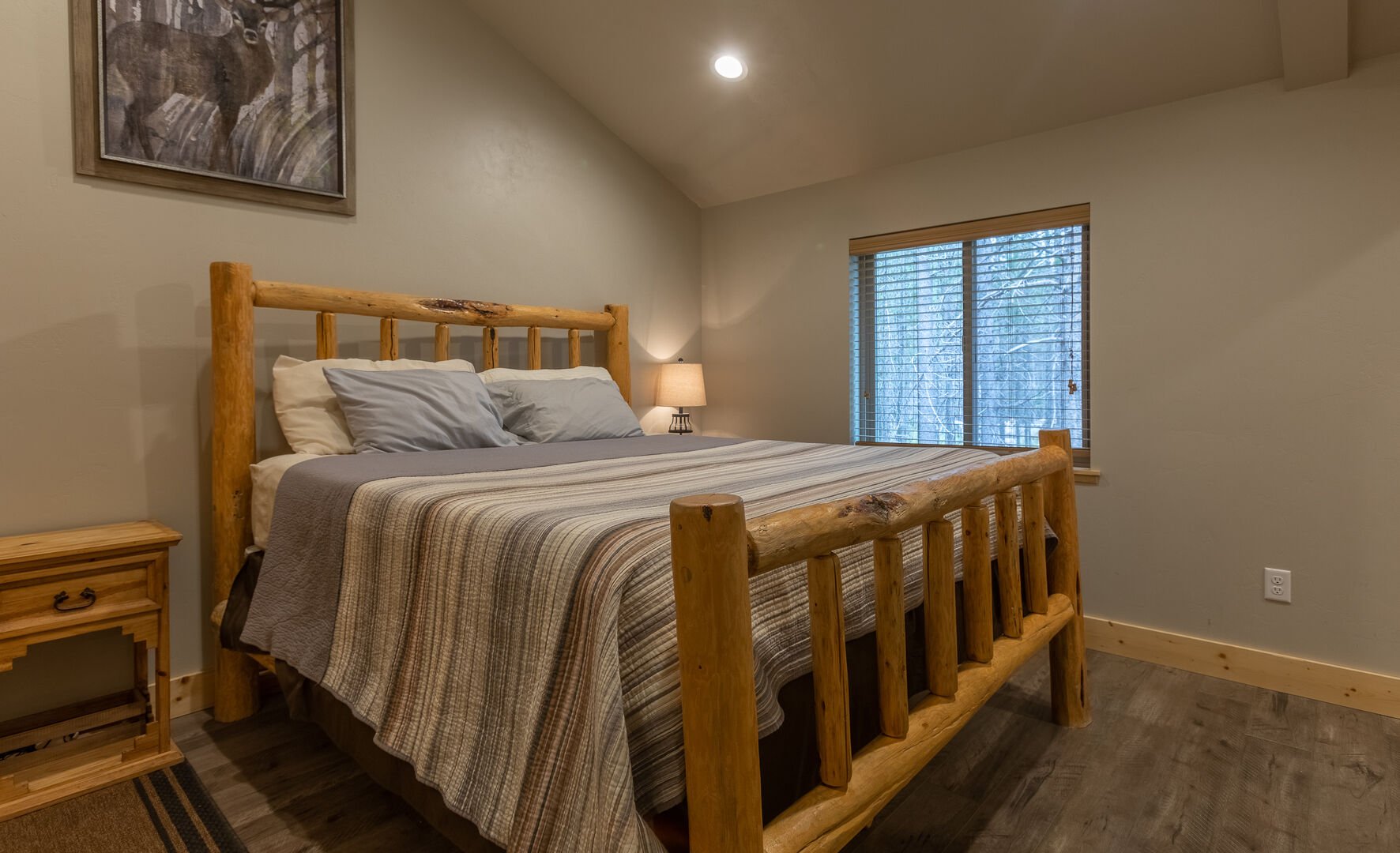 Buck Buck Moose ~ master bedroom on main level w/ king bed and private ensuite bathroom