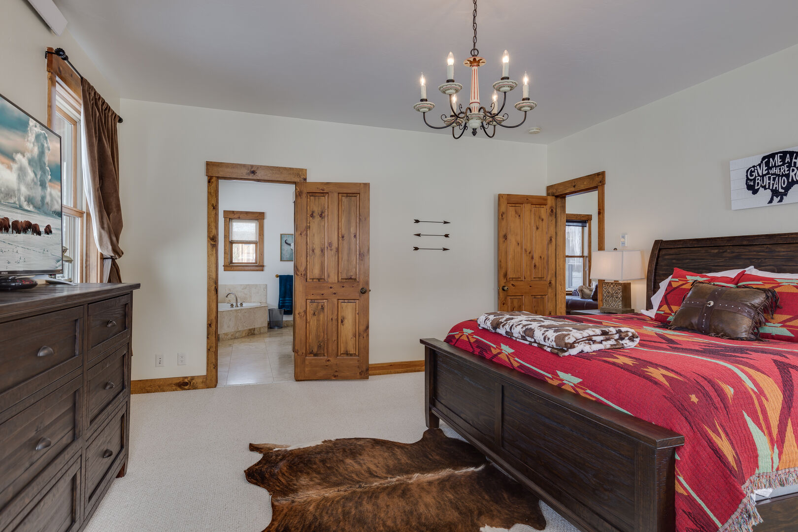 Alpine Airspace ~ master bedroom #1 on main level w/ king bed and private ensuite bathroom
