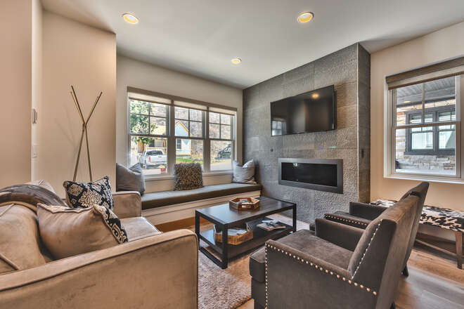 Living Room with Window Bench Seating, Mountain Contemporary Furnishings, Warm Gas Fireplace and Smart TV