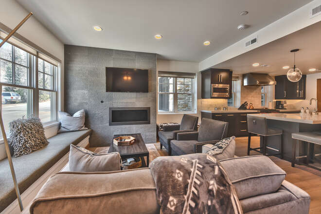 Cozy Living Room with Window Bench Seating, Mountain Contemporary Furnishings, Gas Fireplace and Smart TV