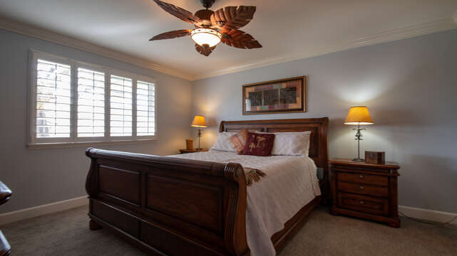 Master Bedroom with a King Bed, Ceiling Fan & TV