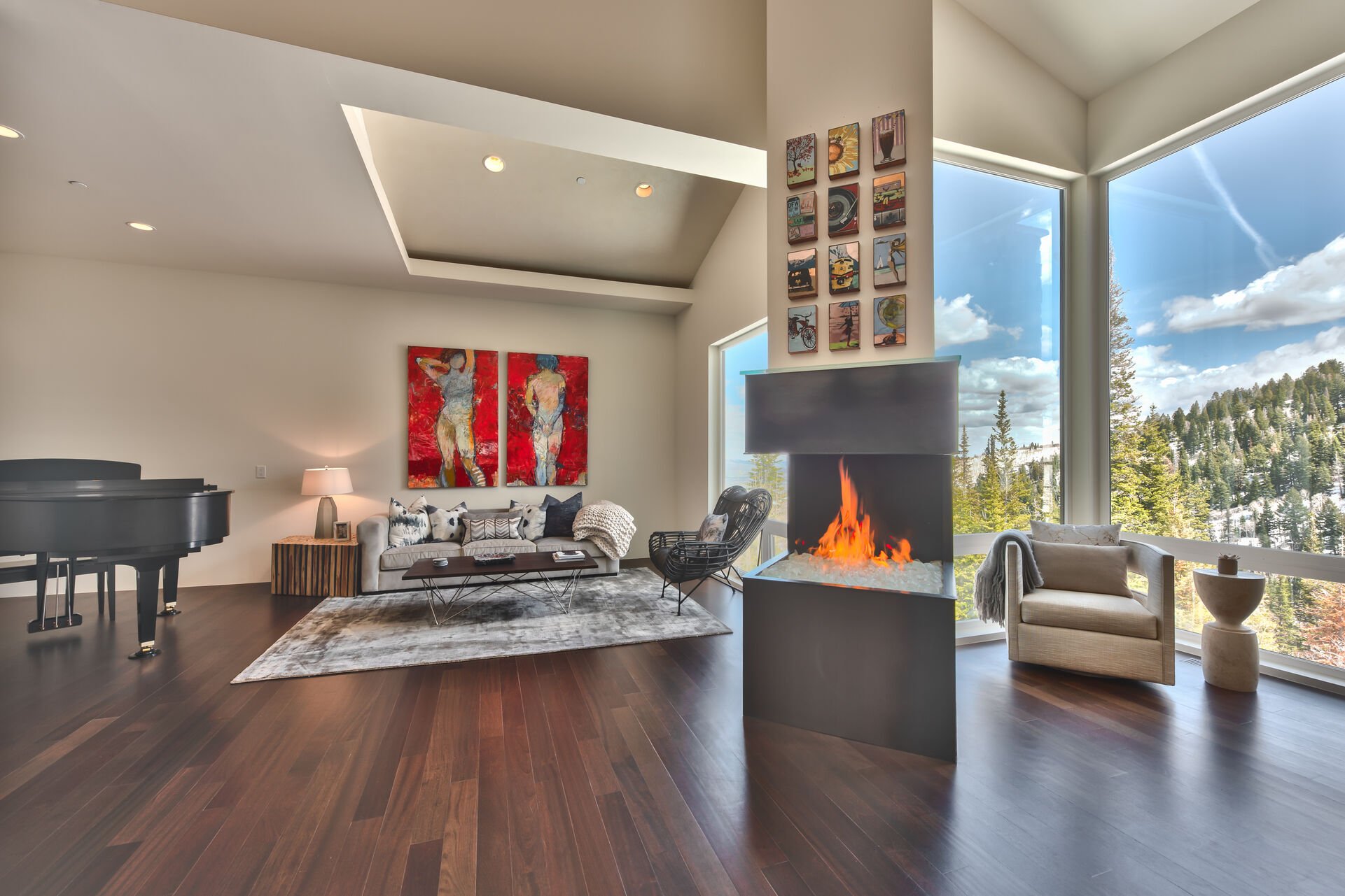 Music Room with a Baby Grand Piano in a Comfortable Space with a Gas Fireplace and Mountain Views