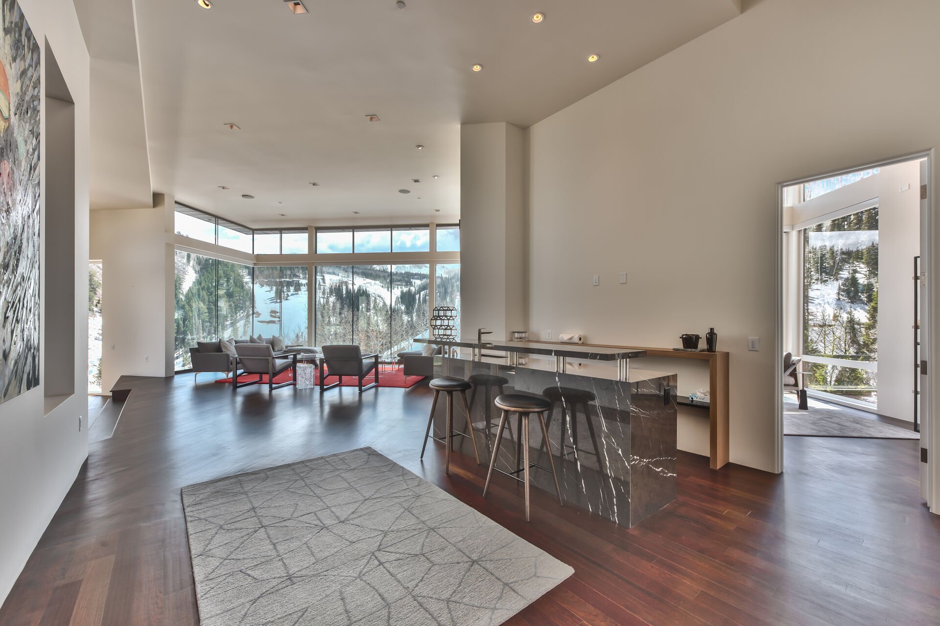 Enter into this Stunning Home Featuring Modern Decor, Hardwood Floors, Impressive Artwork, and Breathtaking Views Throughout