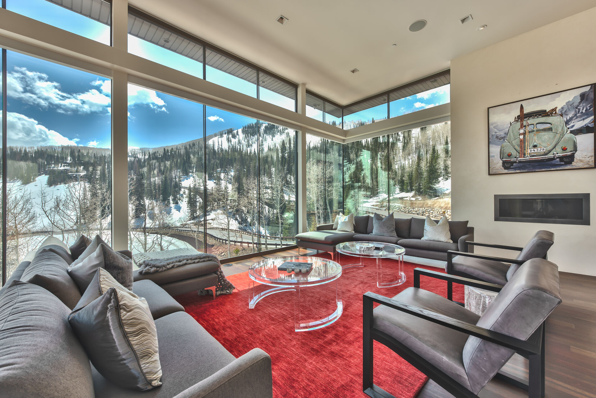 The Stunning Views Start at the Entry Living Room with Floor to Ceiling Windows and Modern Decor