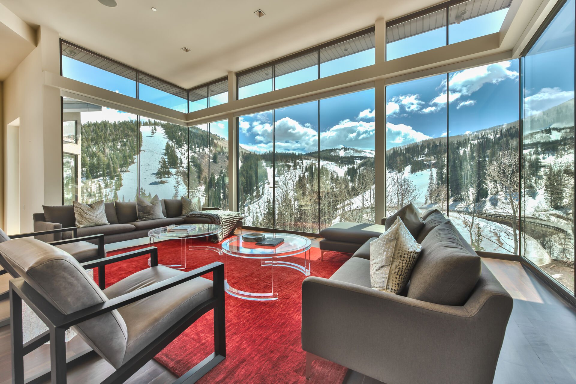 High Ceilings and Massive Windows Surrounded by Mountain Views
