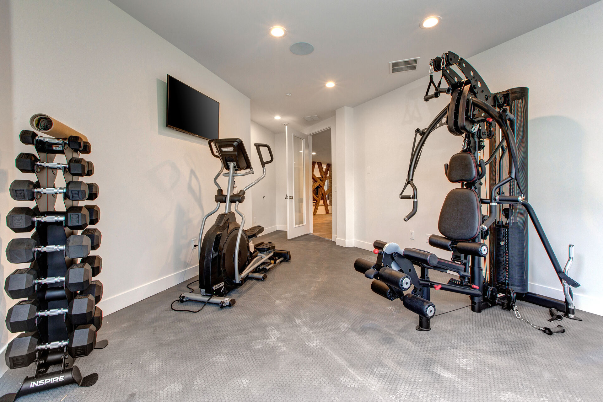 Well Equipped Fitness Center with a Smart TV