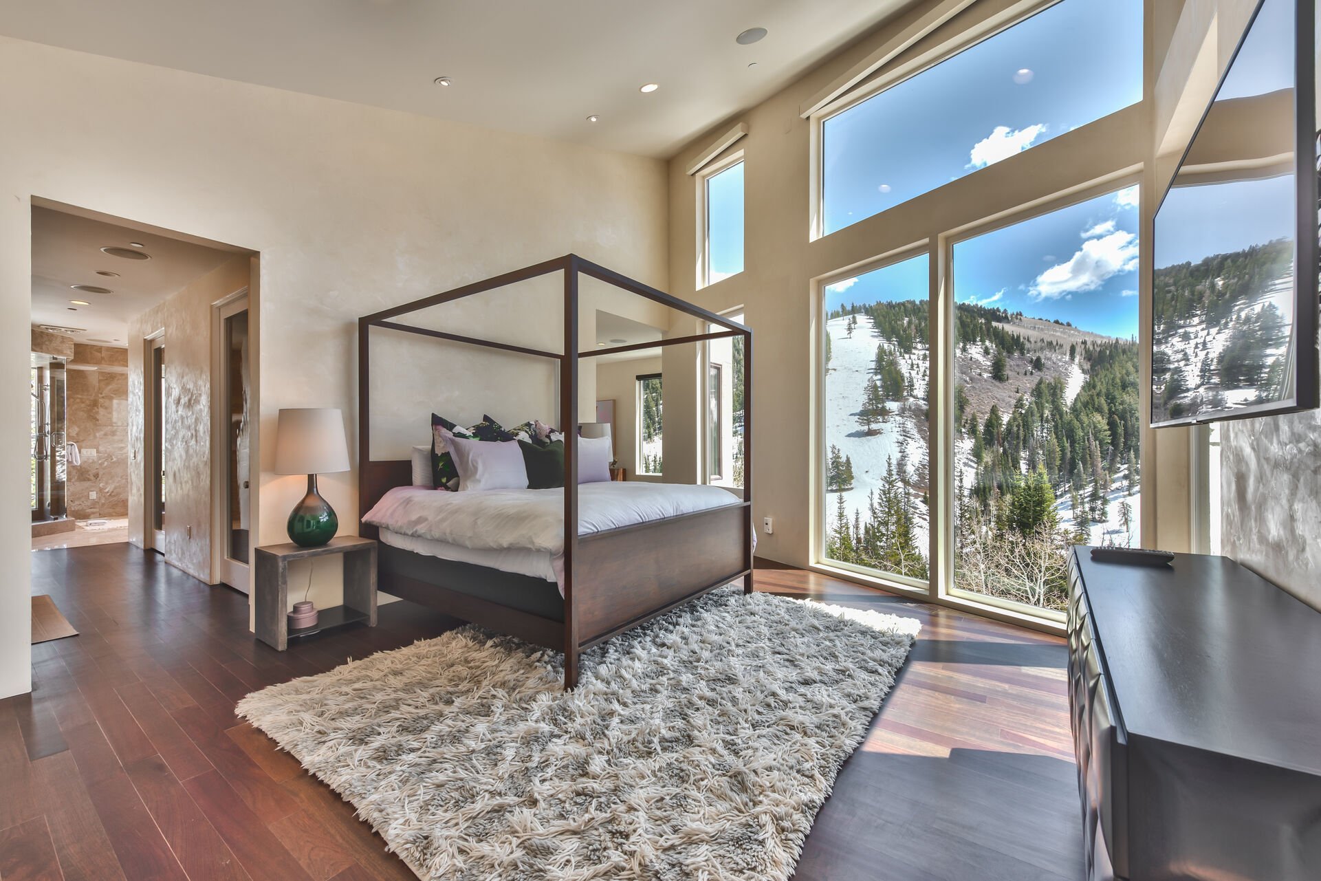 Grand Master Bedroom with a King Bed, Hardwood Floors and Exquisite Views Floor to Ceiling Views