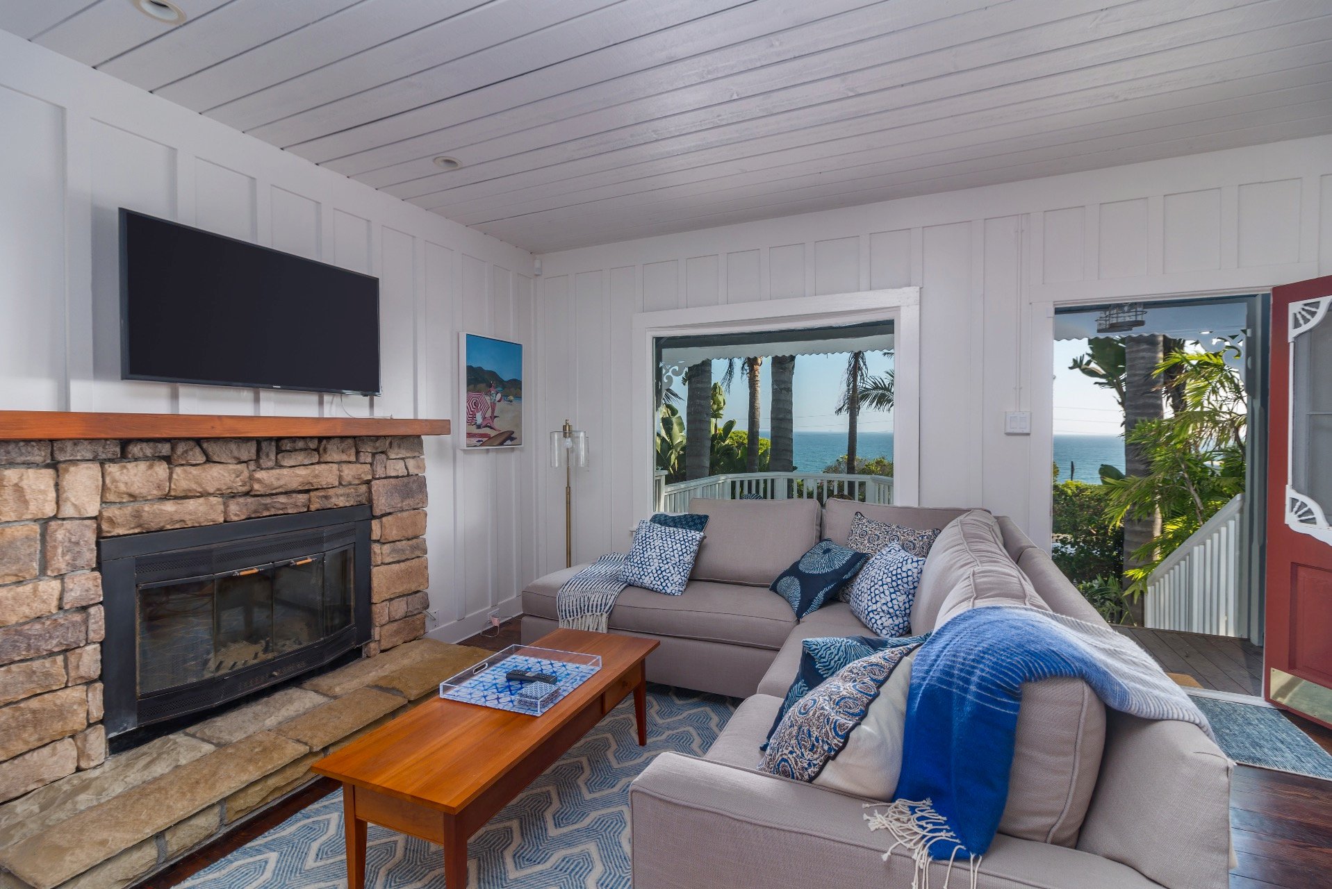 Cozy Living room with flat-screen TV and ocean views.